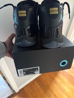 Jordan Retro 11 Low — Black with Teal and Gold Accents